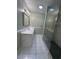Bathroom features glass enclosed shower, toilet, vanity with sink, and tiled floor at 902 N 11Th Ave. N, North Myrtle Beach, SC 29582