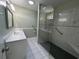 Bathroom featuring tiled floors, glass enclosed shower, toilet, and vanity with sink at 902 N 11Th Ave. N, North Myrtle Beach, SC 29582