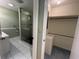 Bathroom featuring tiled floors, glass enclosed shower, toilet, and vanity with sink at 902 N 11Th Ave. N, North Myrtle Beach, SC 29582