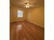 Bedroom with hardwood floors, yellow walls, and a window at 902 N 11Th Ave. N, North Myrtle Beach, SC 29582