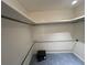 Walk-in closet with rod for hanging clothes, carpeted floors, and a safe at 902 N 11Th Ave. N, North Myrtle Beach, SC 29582