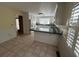 Eat-in kitchen featuring tiled floors and white cabinetry at 902 N 11Th Ave. N, North Myrtle Beach, SC 29582