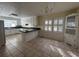 Eat-in kitchen featuring tiled floors and white cabinetry at 902 N 11Th Ave. N, North Myrtle Beach, SC 29582