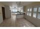 Eat-in kitchen featuring tiled floors and white cabinetry at 902 N 11Th Ave. N, North Myrtle Beach, SC 29582