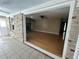 View of living room through doorway featuring hardwood floors and stone fireplace at 902 N 11Th Ave. N, North Myrtle Beach, SC 29582