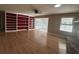 Living room featuring hardwood floors and built-in shelving at 902 N 11Th Ave. N, North Myrtle Beach, SC 29582