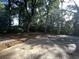 Residential lot featuring mature trees and concrete pad at 902 N 11Th Ave. N, North Myrtle Beach, SC 29582