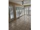 Bright sun room with tiled floors, plantation shutters, and abundant natural light at 902 N 11Th Ave. N, North Myrtle Beach, SC 29582