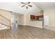 Open-concept living room featuring modern wood floors, staircase and a view of the kitchen at 195 Leadoff Dr., Myrtle Beach, SC 29588