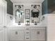Beautiful bathroom featuring double sinks, modern mirrors, and a white shiplap design at 2000 Easy St., Conway, SC 29526