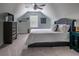 Comfortable bedroom featuring neutral carpeting, bright natural light, and an upholstered headboard at 2000 Easy St., Conway, SC 29526