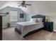 This bedroom features vaulted ceiling, neutral walls, comfortable bedding and a ceiling fan at 2000 Easy St., Conway, SC 29526