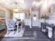 Elegant dining room with stylish furniture, tray ceiling, and decorative wall mirror at 2000 Easy St., Conway, SC 29526