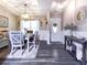 Dining room features decorative lighting, a wood table, and wainscoting at 2000 Easy St., Conway, SC 29526