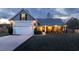 This one-story home has a two-car garage and a cozy front porch, illuminated at dusk at 2000 Easy St., Conway, SC 29526