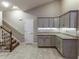 Kitchen has stone countertops, ample storage, and convenient access to the staircase at 2000 Easy St., Conway, SC 29526