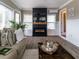 Cozy living room with a fireplace, modern furniture, wood floors, and lots of natural light at 2000 Easy St., Conway, SC 29526