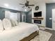 The main bedroom is roomy and includes a fireplace, a ceiling fan, and lots of natural light at 2000 Easy St., Conway, SC 29526