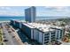 Aerial view of a condo building, beach, and surrounding area at 5905 S Kings Hwy. # 231, Myrtle Beach, SC 29577