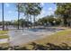 Well-maintained basketball court with blue accents, surrounded by trees and a chain-link fence at 5905 S Kings Hwy. # 231, Myrtle Beach, SC 29577
