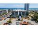 Beautiful condo building with a blue facade, palm trees, and a view of the ocean at 5905 S Kings Hwy. # 231, Myrtle Beach, SC 29577
