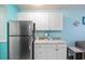 Kitchenette area showcasing modern appliances, countertops, cabinets, and a coffee maker at 5905 S Kings Hwy. # 231, Myrtle Beach, SC 29577