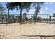 Swing set in a sandy playground area, with other playground equipment and picnic tables nearby at 5905 S Kings Hwy. # 231, Myrtle Beach, SC 29577