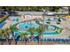 Aerial view of the water park featuring a lazy river, water features, lounge chairs, and a bathhouse at 5905 S Kings Hwy. # 231, Myrtle Beach, SC 29577