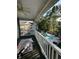 Private balcony overlooking community pool, surrounding greenery, and outdoor seating at 674 Riverwalk Dr. # 301, Myrtle Beach, SC 29579