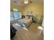 Bright bedroom with vaulted ceiling, ample light, wood-look flooring, and coastal accents at 674 Riverwalk Dr. # 301, Myrtle Beach, SC 29579