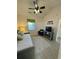 Bright bedroom with a cozy daybed, a TV, and a ceiling fan for added comfort at 674 Riverwalk Dr. # 301, Myrtle Beach, SC 29579