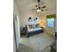 Cozy bedroom featuring a daybed, ceiling fan, and light wood-look flooring at 674 Riverwalk Dr. # 301, Myrtle Beach, SC 29579