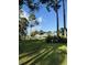 Scenic golf course view with lush green grass, towering trees, and clear blue sky, creating a serene landscape at 674 Riverwalk Dr. # 301, Myrtle Beach, SC 29579