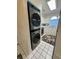 Efficient laundry area featuring a stackable washer and dryer, with tile flooring at 674 Riverwalk Dr. # 301, Myrtle Beach, SC 29579
