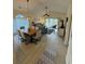 Open concept living area with vaulted ceiling, ceiling fan, modern lighting and sliding glass door at 674 Riverwalk Dr. # 301, Myrtle Beach, SC 29579
