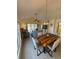 Open concept living area with vaulted ceiling, ceiling fan, modern lighting and sliding glass door at 674 Riverwalk Dr. # 301, Myrtle Beach, SC 29579