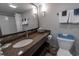 Bathroom features a granite vanity, contemporary lighting, and well-organized towel storage at 6900 N Ocean Blvd. # 405, Myrtle Beach, SC 29572