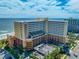 A beachfront resort with a glass enclosed pool and direct beach access with tropical landscaping at 6900 N Ocean Blvd. # 405, Myrtle Beach, SC 29572