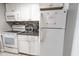Efficient kitchen featuring white appliances, granite counters, and ample cabinet storage at 6900 N Ocean Blvd. # 405, Myrtle Beach, SC 29572