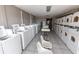 Clean and bright laundry room equipped with multiple washing machines and dryers at 6900 N Ocean Blvd. # 405, Myrtle Beach, SC 29572