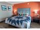 Comfortable main bedroom featuring a queen bed adorned with stylish quilt and decorative pillows at 6900 N Ocean Blvd. # 405, Myrtle Beach, SC 29572