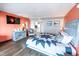 Stylish main bedroom featuring a queen bed, a TV, and a partial view of the kitchen area at 6900 N Ocean Blvd. # 405, Myrtle Beach, SC 29572