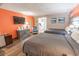 Inviting main bedroom with two beds and a partial view of the kitchen area and an accent chair at 6900 N Ocean Blvd. # 405, Myrtle Beach, SC 29572