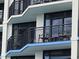 Exterior view of condo balconies with chairs and black metal railings at 7100 N Ocean Blvd. # 819, Myrtle Beach, SC 29572