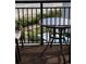 Condo balcony with outdoor furniture overlooking a pool and landscaped backyard at 7100 N Ocean Blvd. # 819, Myrtle Beach, SC 29572
