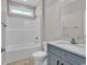 Bathroom features a shower-tub, a toilet, and a vanity with a large mirror at 107 Deans Ct., Green Sea, SC 29545