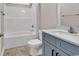 Bathroom features a shower-tub, a toilet, and a vanity with a large mirror at 107 Deans Ct., Green Sea, SC 29545