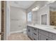 Bathroom includes double vanity with grey cabinets, framed mirror, and tile flooring at 107 Deans Ct., Green Sea, SC 29545