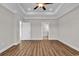 Primary bedroom includes luxury vinyl plank flooring, and ensuite bathroom access at 107 Deans Ct., Green Sea, SC 29545
