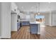 Modern kitchen features an island, stainless steel appliances, blue and white cabinets, and an open layout for easy entertaining at 107 Deans Ct., Green Sea, SC 29545